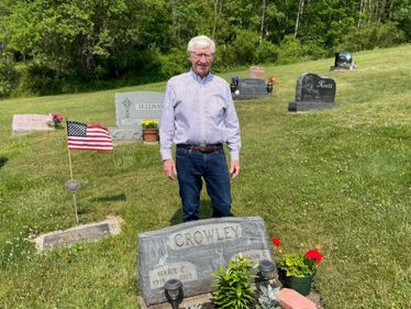 Bob Crowley visits the resting place of his parents.