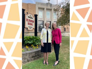 Kathryn Eisert and Lisa Louis, Executive Director, at Saint Stephen School in Oil City