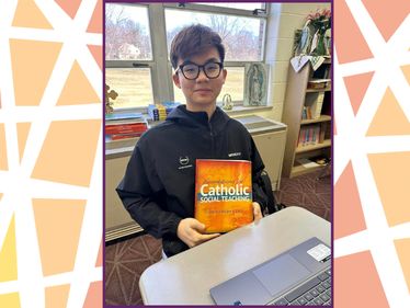 Kennedy Catholic student with new theology textbook